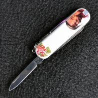 Нож складной, мультитул Victorinox Classic SD Ukraine Козак (58мм, 7 функций), белый 0.6223.7R2